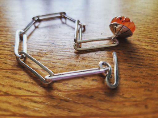 Solid silver chain with carnelian charm £210